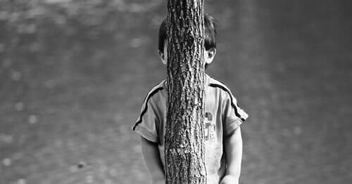 Hiding behind a tree with groovy bark