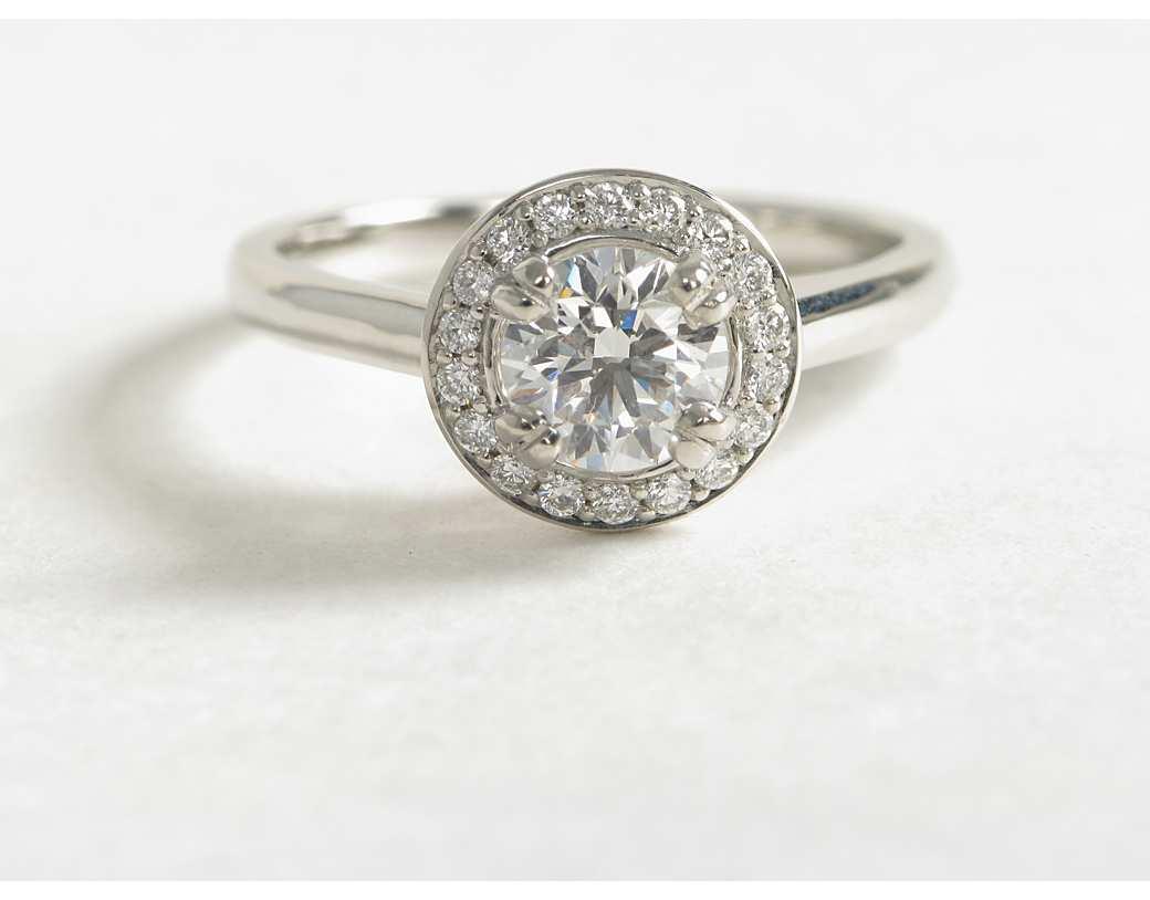Halo diamond ring setting with pave diamonds